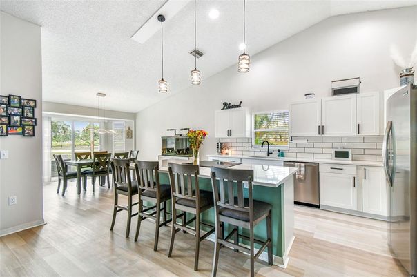Dining room, Interior, Kitchen, Pendant Lights, Recessed Lighting, Stainless Steel Appliances, Wood Texture Flooring