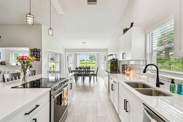 Dining room, Interior, Kitchen, Pendant Lights, Stainless Steel Appliances, Wood Texture Flooring