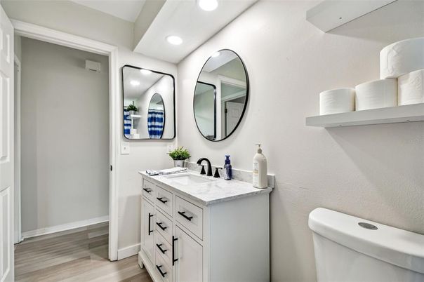 Bathroom, Dual Sink Vanities, Interior, Recessed Lighting, Wood Texture Flooring