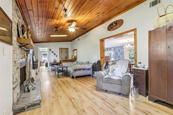 Chandelier, Dining room, Fireplace, Interior, Living room, Stone Walls, Wooden Ceilings, Wood Texture Flooring