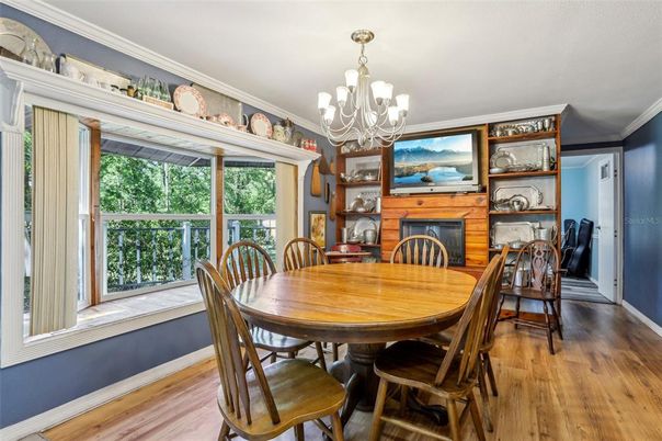 Chandelier, Dining room, Fireplace, Interior, Wood Texture Flooring