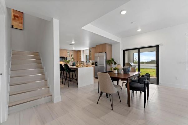 Dining room, Interior, Kitchen, Recessed Lighting, Stainless Steel Appliances, Wood Texture Flooring