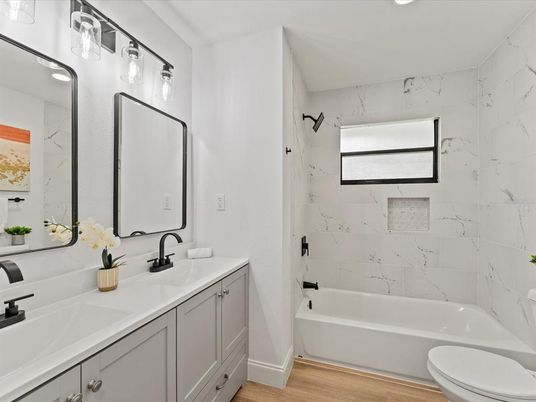 Bathroom, Dual Sink Vanities, Interior, Marble Walls, Wood Texture Flooring