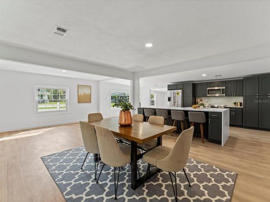 Dining room, Interior, Kitchen, Recessed Lighting, Stainless Steel Appliances, Wood Texture Flooring