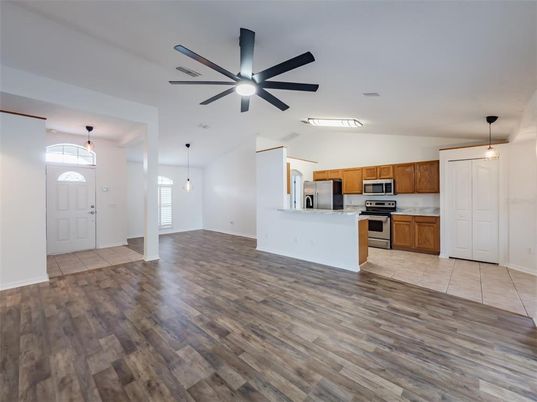 Empty room, Interior, Kitchen, Pendant Lights, Stainless Steel Appliances, Wood Texture Flooring