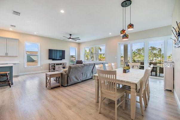 Dining room, Fireplace, Interior, Living room, Pendant Lights, Recessed Lighting, Wood Texture Flooring