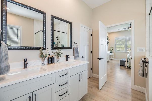 Bathroom, Dual Sink Vanities, Interior, Recessed Lighting, Wood Texture Flooring