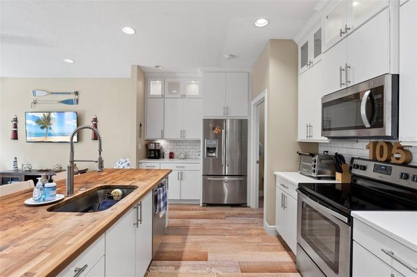 Interior, Kitchen, Recessed Lighting, Stainless Steel Appliances, Wood Texture Flooring