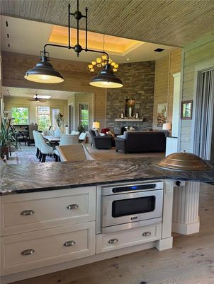 Dining room, Interior, Kitchen, Living room, Pendant Lights, Stainless Steel Appliances, Stone Walls, Wooden Ceilings, Wood Texture Flooring
