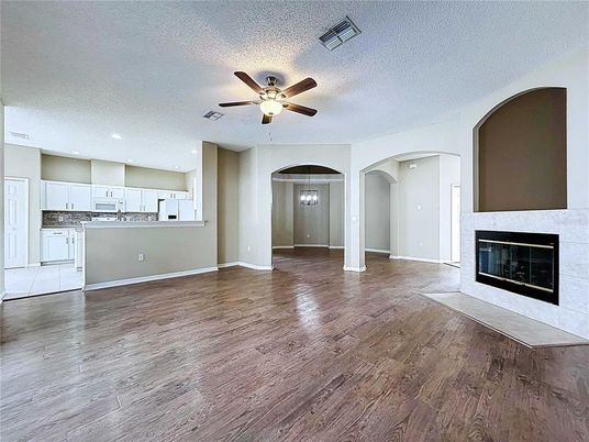 Empty room, Fireplace, Interior, Kitchen, Pendant Lights, Recessed Lighting, Wood Texture Flooring