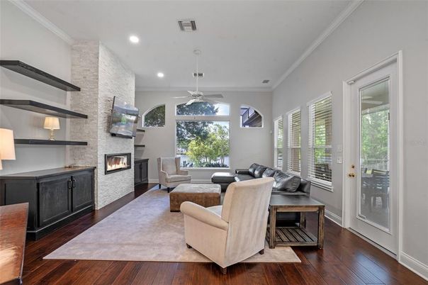 Fireplace, Interior, Living room, Recessed Lighting, Stone Walls, Wood Texture Flooring
