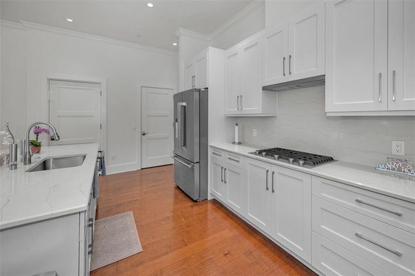 Interior, Kitchen, Marble Walls, Recessed Lighting, Stainless Steel Appliances, Wood Texture Flooring