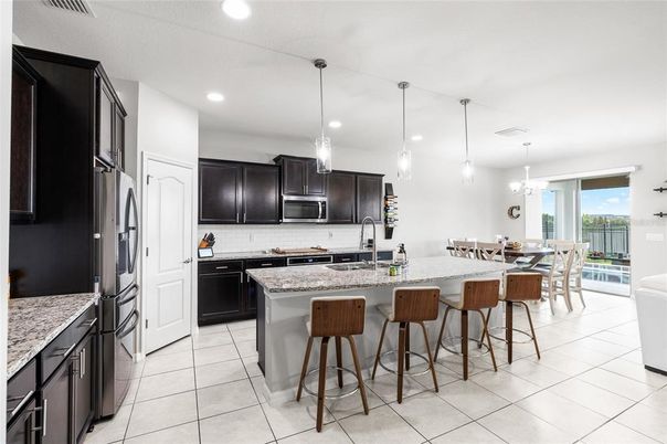 Chandelier, Dining room, Interior, Kitchen, Pendant Lights, Recessed Lighting, Stainless Steel Appliances