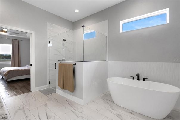 Bathroom, Bedroom, Free Standing Baths, Glass Shower, Interior, Marble, Marble Walls, Recessed Lighting, Wood Texture Flooring