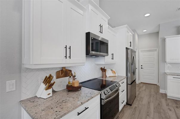 Interior, Kitchen, Recessed Lighting, Stainless Steel Appliances, Wood Texture Flooring