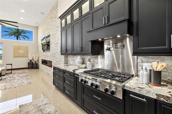 Fireplace, Interior, Kitchen, Recessed Lighting, Stainless Steel Appliances, Stone Walls