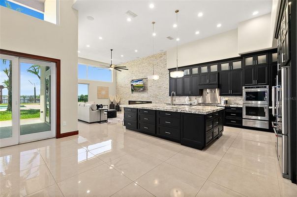 Interior, Kitchen, Pendant Lights, Recessed Lighting, Stainless Steel Appliances, Stone Walls