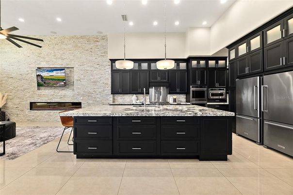 Interior, Kitchen, Pendant Lights, Recessed Lighting, Stainless Steel Appliances, Stone Walls