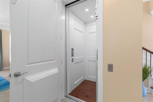 Elevator, Interior, Recessed Lighting, Wood Texture Flooring