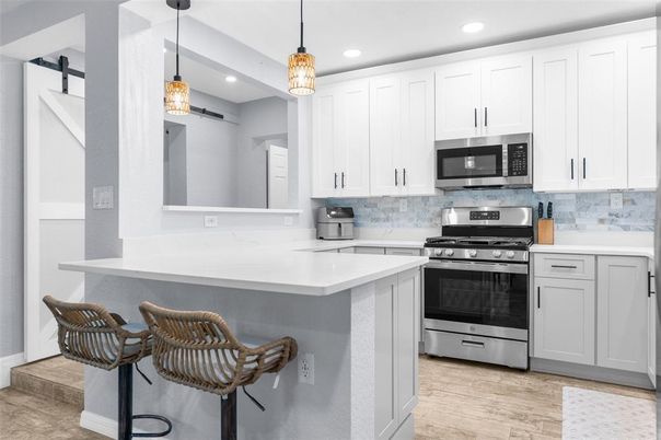 Interior, Kitchen, Pendant Lights, Recessed Lighting, Stainless Steel Appliances, Wood Texture Flooring