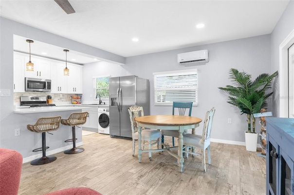 Dining room, Interior, Kitchen, Pendant Lights, Recessed Lighting, Stainless Steel Appliances, Wood Texture Flooring