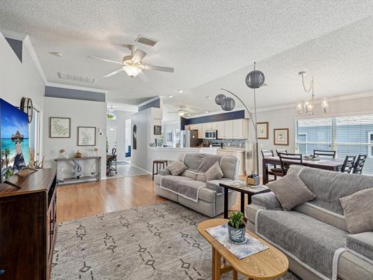 Chandelier, Dining room, Interior, Kitchen, Living room, Pendant Lights, Recessed Lighting, Stainless Steel Appliances, Wood Texture Flooring