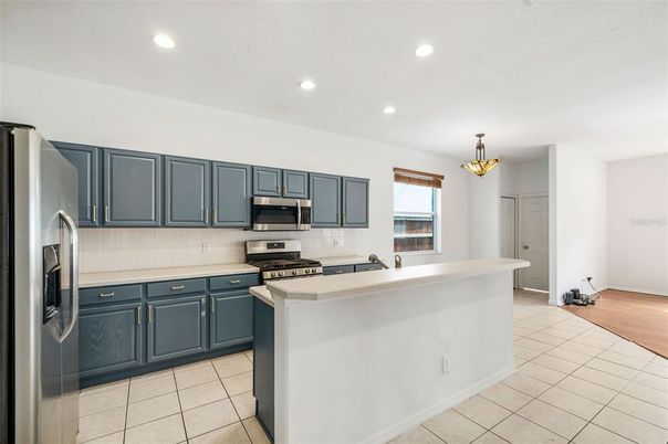 Chandelier, Interior, Kitchen, Recessed Lighting, Stainless Steel Appliances, Wood Texture Flooring