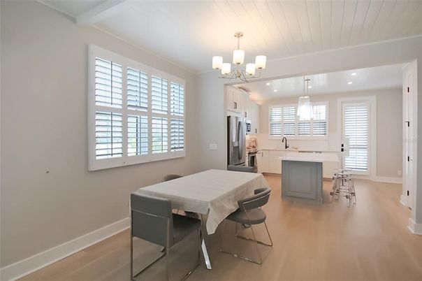 Chandelier, Dining room, Interior, Kitchen, Recessed Lighting, Stainless Steel Appliances, Wood Texture Flooring