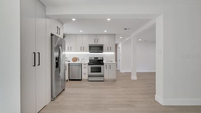 Interior, Kitchen, Recessed Lighting, Stainless Steel Appliances, Wood Texture Flooring