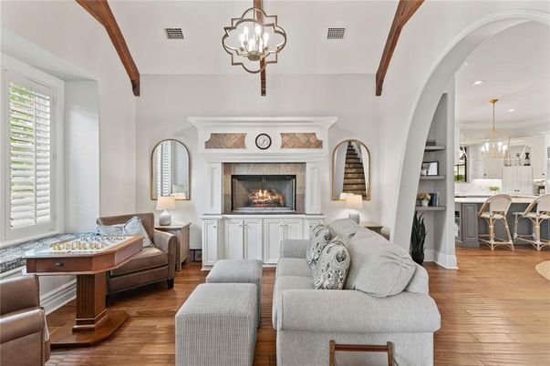 Chandelier, Fireplace, Interior, Kitchen, Living room, Pendant Lights, Recessed Lighting, Wood Texture Flooring