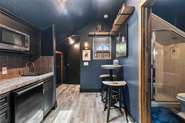 Bathroom, Glass Shower, Interior, Kitchen, Tile Countertops, Wood Texture Flooring