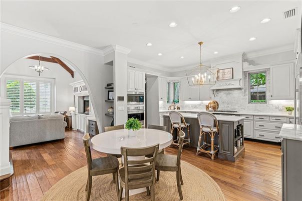 Chandelier, Dining room, Interior, Kitchen, Living room, Pendant Lights, Recessed Lighting, Stainless Steel Appliances, Wood Texture Flooring