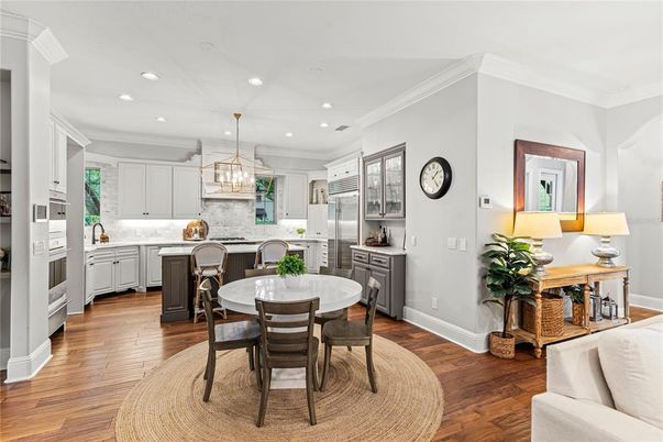 Chandelier, Dining room, Interior, Kitchen, Pendant Lights, Recessed Lighting, Stainless Steel Appliances, Wood Texture Flooring