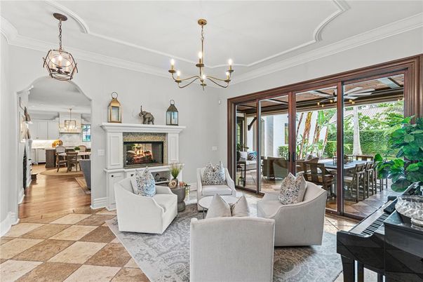 Chandelier, Dining room, Fireplace, Interior, Living room, Pendant Lights, Piano, Wood Texture Flooring