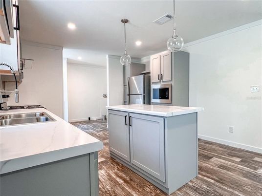 Interior, Kitchen, Pendant Lights, Recessed Lighting, Stainless Steel Appliances, Wood Texture Flooring