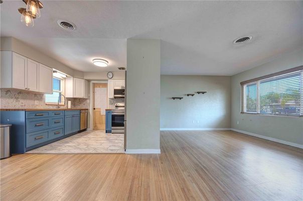 Empty room, Interior, Kitchen, Stainless Steel Appliances, Wood Texture Flooring