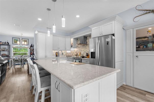 Dining room, Interior, Kitchen, Pendant Lights, Recessed Lighting, Stainless Steel Appliances, Wood Texture Flooring