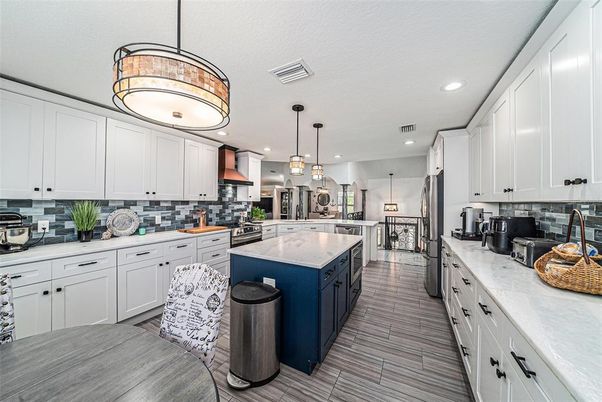 Interior, Kitchen, Pendant Lights, Recessed Lighting, Stainless Steel Appliances, Wood Texture Flooring