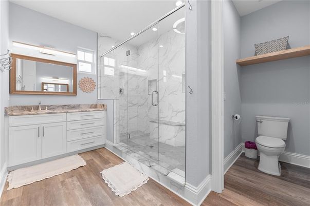 Bathroom, Glass Shower, Interior, Marble, Marble Walls, Recessed Lighting, Wood Texture Flooring