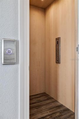 Elevator, Interior, Recessed Lighting, Wooden Ceilings, Wood Texture Flooring, Wooden Walls