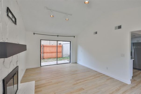 Empty room, Fireplace, Interior, Kitchen, Recessed Lighting, Wood Texture Flooring