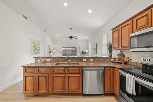 Interior, Kitchen, Recessed Lighting, Stainless Steel Appliances, Wood Texture Flooring