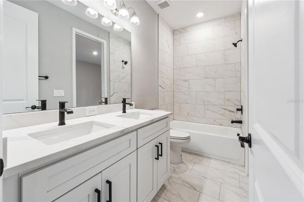 Bathroom, Dual Sink Vanities, Interior, Marble, Marble Walls, Recessed Lighting