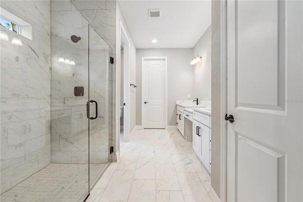 Bathroom, Dual Sink Vanities, Glass Shower, Interior, Marble, Marble Walls, Recessed Lighting