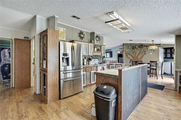 Dining room, Interior, Kitchen, Pendant Lights, Stainless Steel Appliances, Wood Texture Flooring