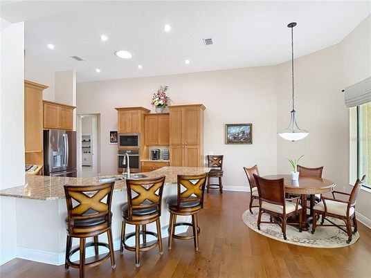 Dining room, Interior, Kitchen, Pendant Lights, Recessed Lighting, Stainless Steel Appliances, Wood Texture Flooring