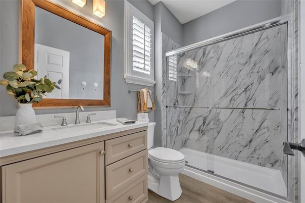 Bathroom, Glass Shower, Interior, Marble Walls, Wood Texture Flooring