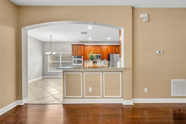 Chandelier, Interior, Kitchen, Recessed Lighting, Stainless Steel Appliances, Wood Texture Flooring