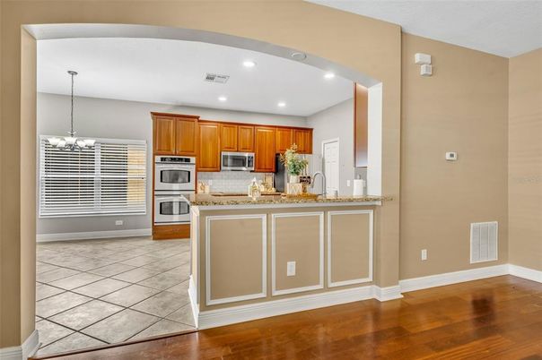 Chandelier, Interior, Kitchen, Recessed Lighting, Stainless Steel Appliances, Wood Texture Flooring