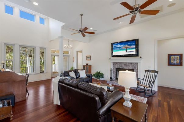 Chandelier, Fireplace, Interior, Living room, Recessed Lighting, Wood Texture Flooring